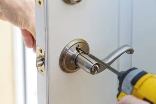 Commercial lock replacement service with new door hardware